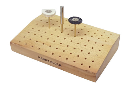 Wooden tool stand for drills with a few accessories in the stand