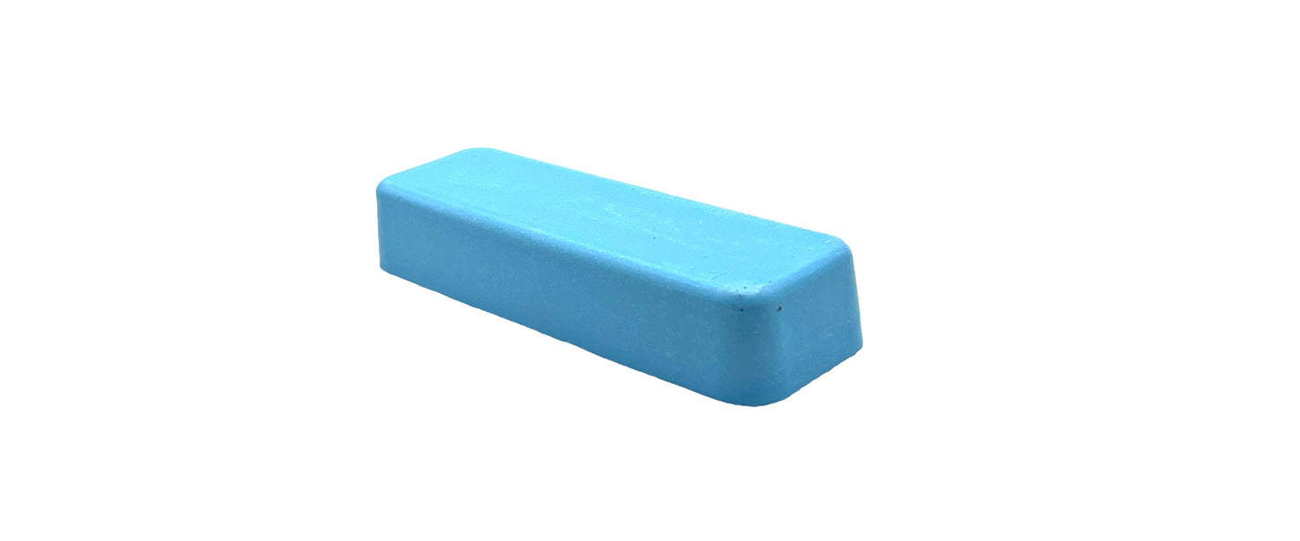A blue bar of Blue Polishing Compound for non-ferrous metals.