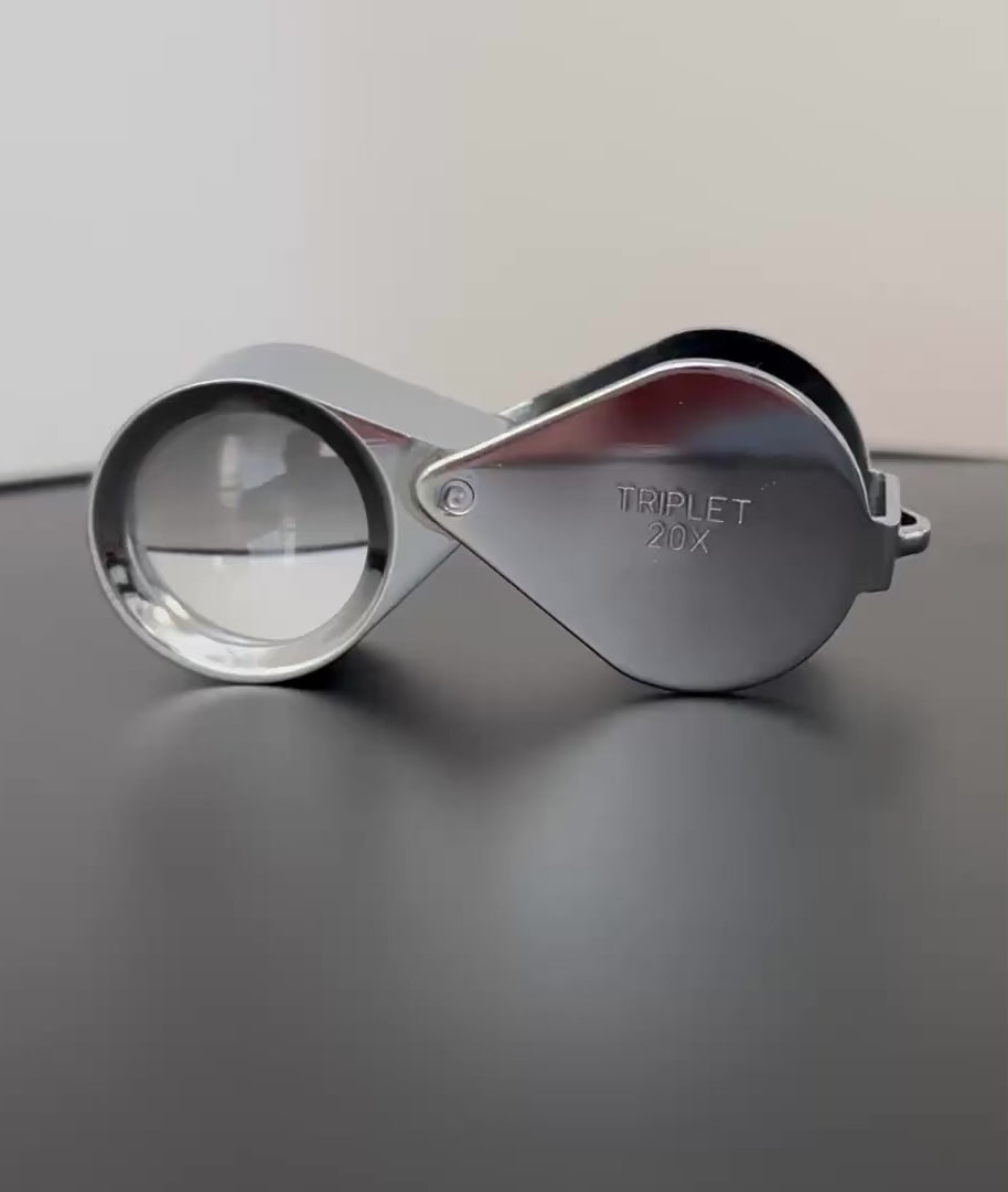 Video of a chrome loupe rotating